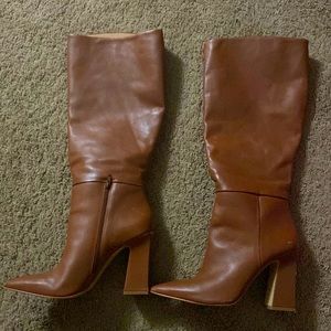 Size 10 women Steve Madden knee high boots.